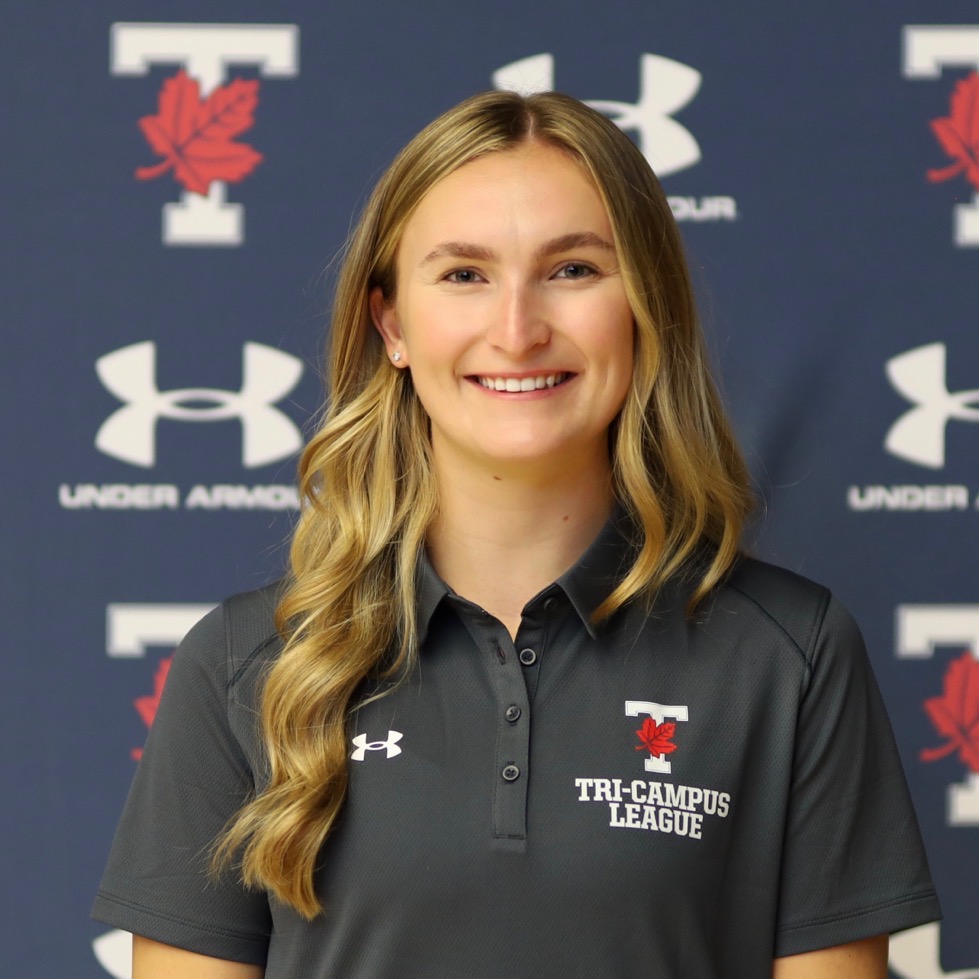 Headshot of Alora RIddle smiling and wearing a U of T Tri-Campus League shirt against a navy blue background with the TLeaf and Under Armour logos