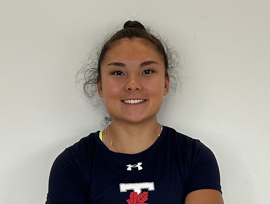 Headshot of Vanessa Lin smiling and wearing a black t-shirt with the U of T TLeaf logo against a white background