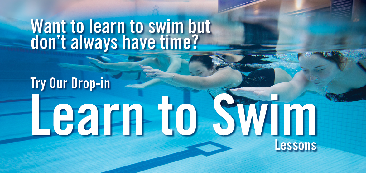 learn to swim class participants push off the wall under water