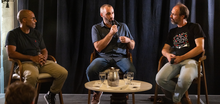 Daniel Sailofsky in conversation with panelists at capitalist sport talk