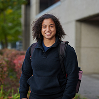 smiling female student with backpack