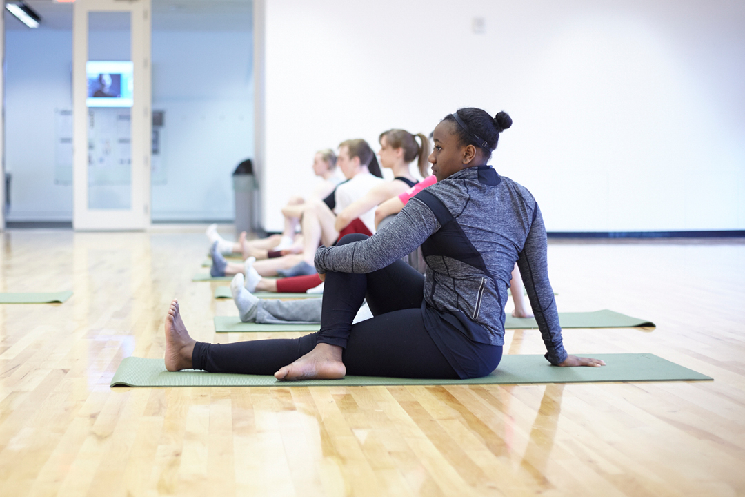 women stretching in a yoga class