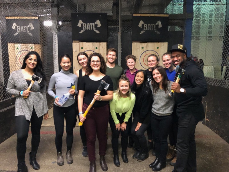 students in the Adapt lab pose for a group photo at a 2019 axe-throwing event