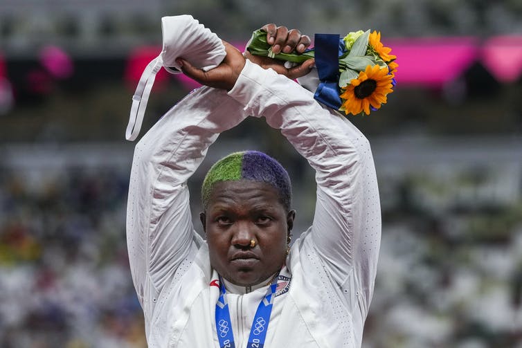 American athlete Raven Saunders poses with her silver medal at the 2020 Olympic Games