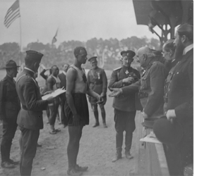 John Armstrong Howard receiving his bronze medal for the 100-metre event from the King of Montenegro, at the Inter-Allied Games in Pershing Stadium, Paris, July 1919 