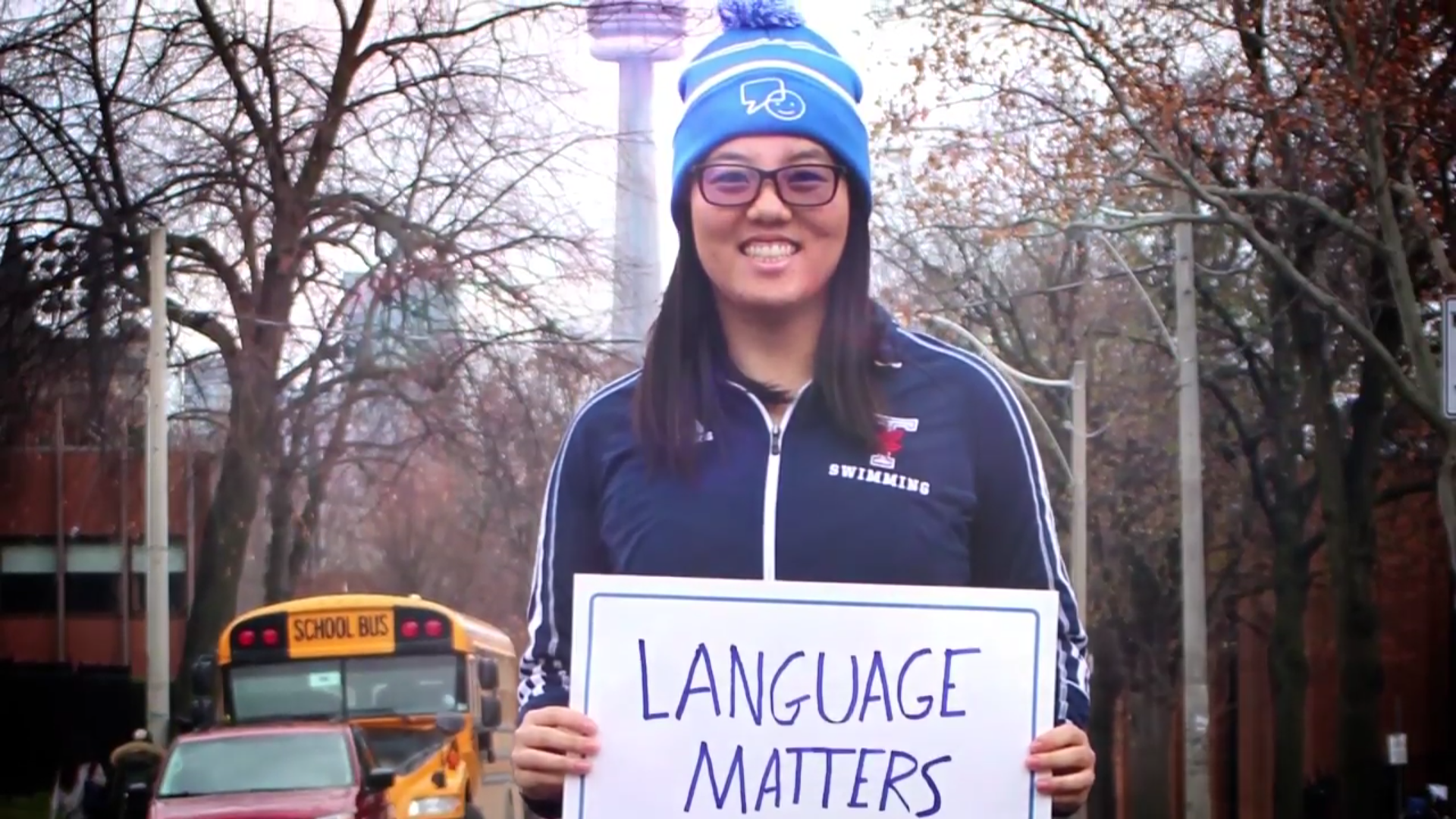 Varsity Blues Nathalin Moy holds up a sign for Bell Canada's Let Talk mental health campaign