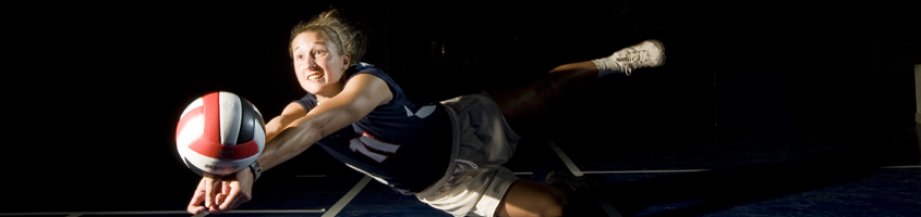 Woman doing a volleyball catch