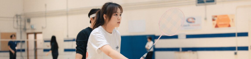 A girl playing Badminton