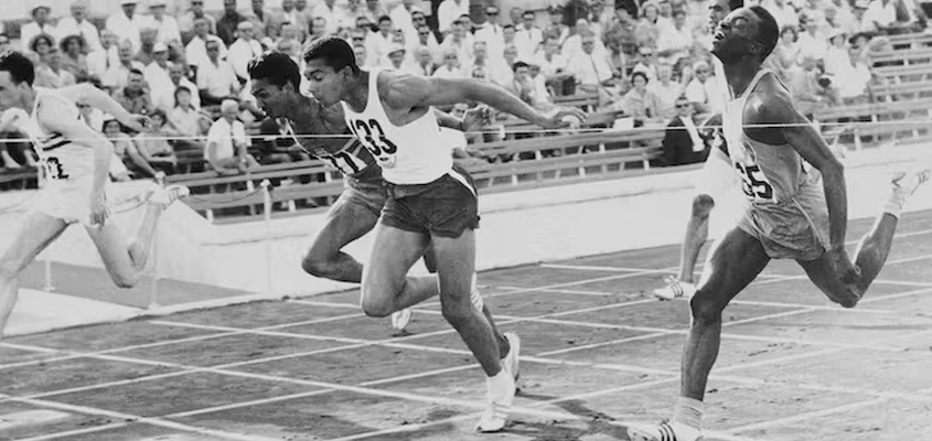 Two Black Athletes competing in Track & Field