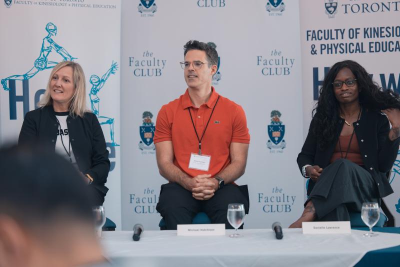 Catherine Sabiston, Michael Hutchinson and Danielle Lawrence take questions from the audience while sitting on a panel in front of KPE-branded signage.