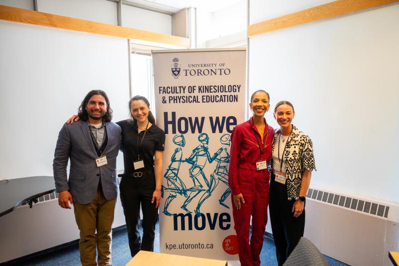 Keynote panelists (L to R) Dr. Nima Dehghansai, Christine Camozzi, and Marika Warner, along with Kathryn Johnston stand in front of the KPE "How we move" banner.