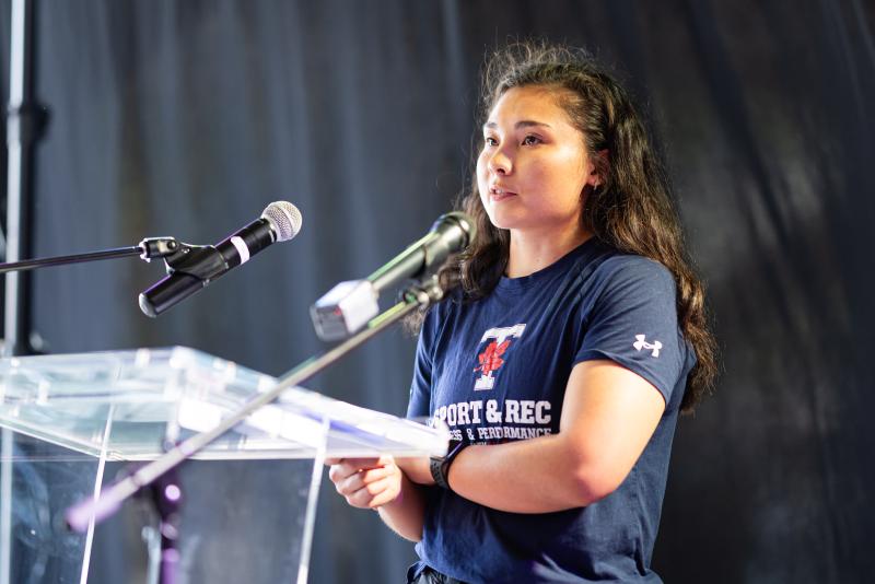 Vanessa Lin speaks at a podium