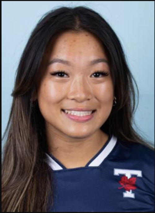Headshot of Cassie Chan smiling and wearing a blue shirt with the U of T TLeaf logo