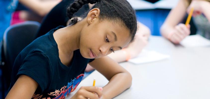 A girl writing down her ideas