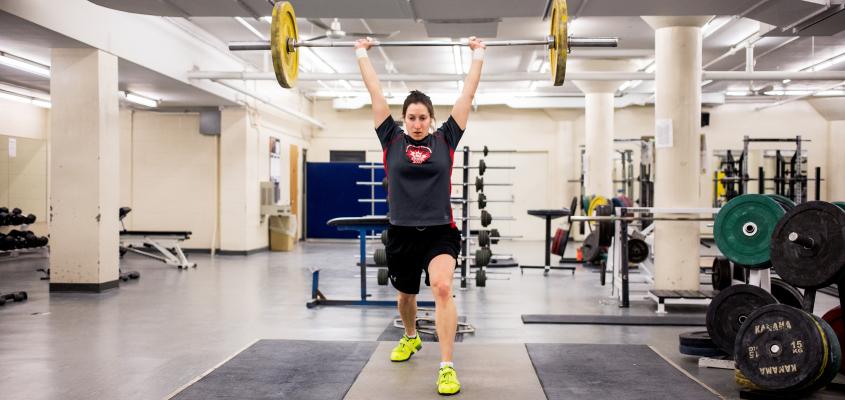 A woman lifting weights over her head