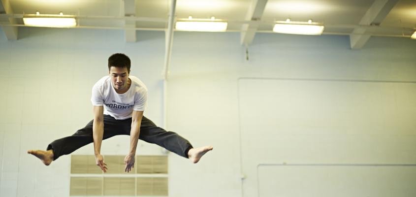 Man leaping over a structure