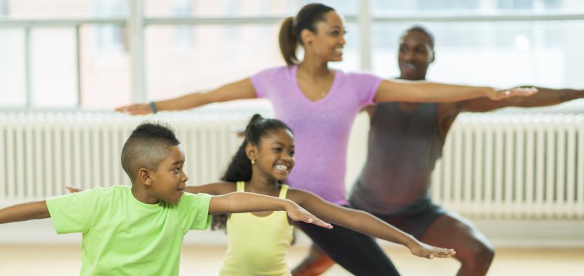A family doing Yoga