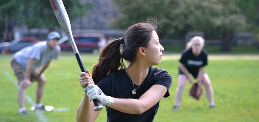 student playing softball