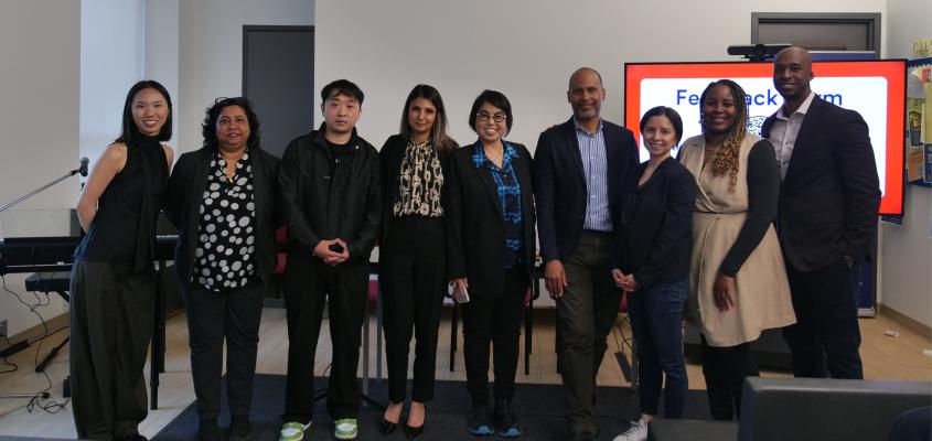 Panelists, facilitators and organizers of a successful event gather for a team picture