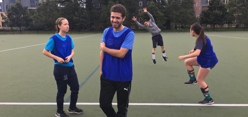 Four recreational soccer players having fun in the rain