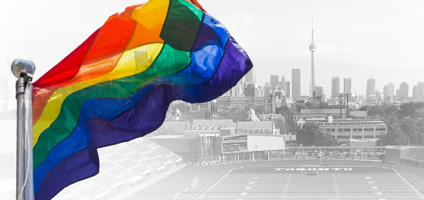 Image of pride flag waving over City of Toronto skyline