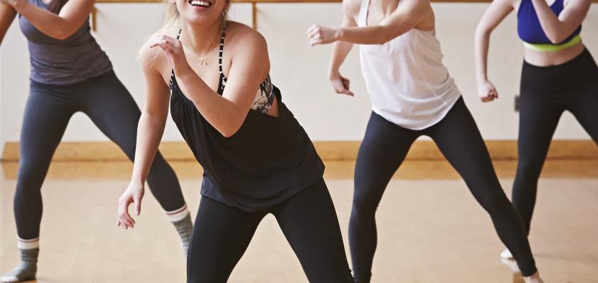 Group of women, dancing, laughing in a studio
