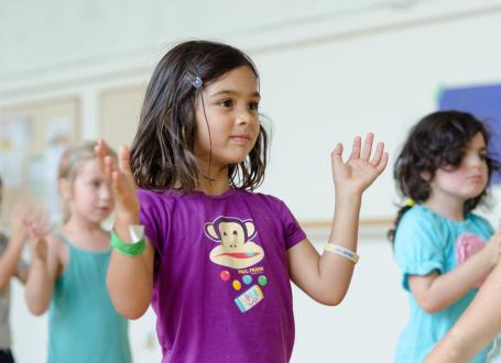 Kids learning basic dance skills