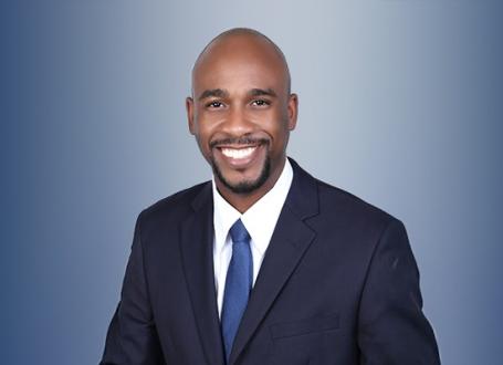 Dalton Myers smiling in image with a blue backdrop